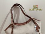 Coach Canvas Tote With Snap Button Design – A Versatile And Fashionable Handbag. - Image 2