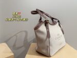 Coach Canvas Tote With Snap Button Design – A Versatile And Fashionable Handbag. - Image 3