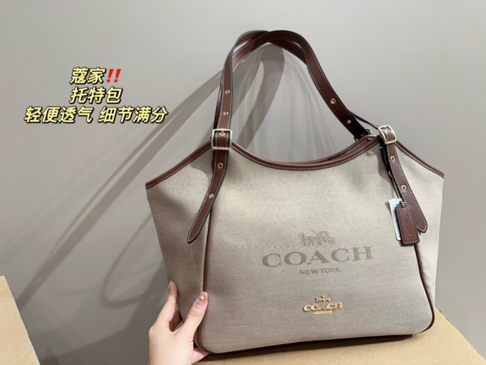 Coach Canvas Tote With Snap Button Design – A Versatile And Fashionable Handbag. - Image 4