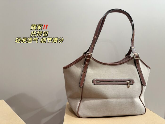 Coach Canvas Tote With Snap Button Design – A Versatile And Fashionable Handbag. - Image 7