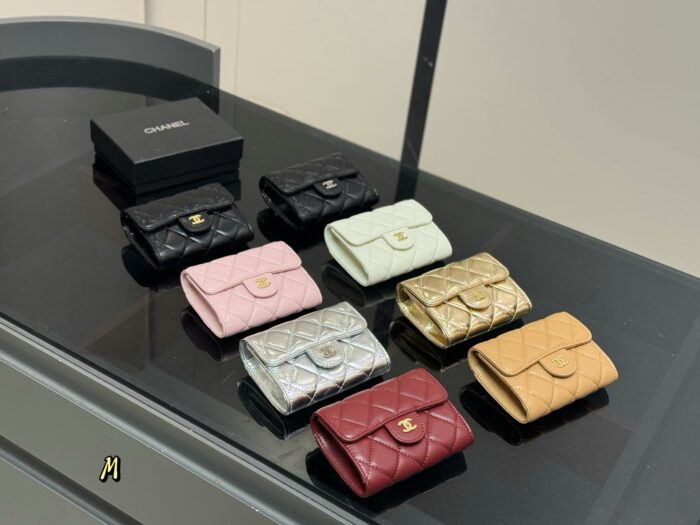 Chanel Black Gold Mini Chain Wallet Classic Black With Shimmering Gold Chain Design Compact And Portable - Image 1