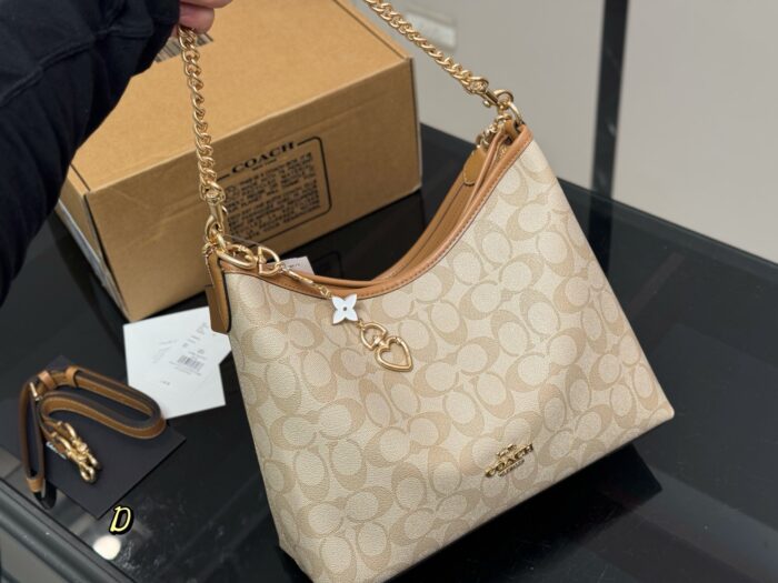 Coach Laurel Hobo Bag With Dual Straps For Versatile Carrying, Featuring Zipped Side Pocket - Image 2