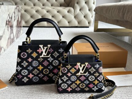 Louis Vuitton Capucines Lady Bag  Gold-Tone Hardware, Monogrammed Large Logo, Extra-Wide Shoulder Strap, Handheld Or Shoulder-Carried.
