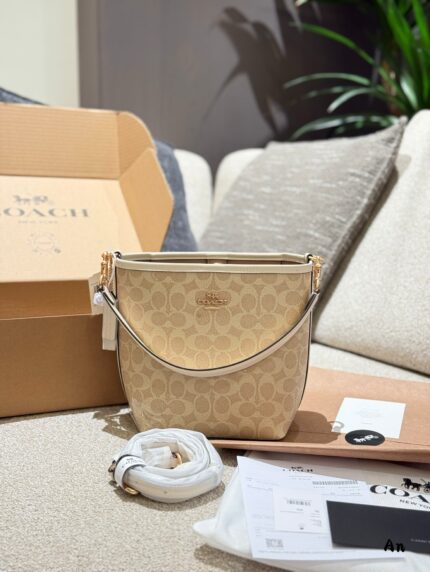 Coach Newcity Bucket Bag Dual-Strap Versatility Light Tea-Coloured New Shade Lightweight And Practical