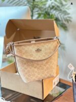 Coach Newcity Bucket Bag Dual-Strap Versatility Light Tea-Coloured New Shade Lightweight And Practical - Image 12