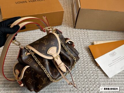 Louis Vuitton Odyssée Metal Chain Handbag With Shoulder Strap And Crossbody Option, Side Pocket Design