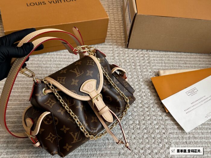 Louis Vuitton Odyssée Metal Chain Handbag With Shoulder Strap And Crossbody Option, Side Pocket Design - Image 1