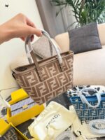 Fendi Mini Roll Monogram Bag - Dumpling-Shaped Design With Adjustable Shoulder Strap, Lightweight Yet Spacious. - Image 4