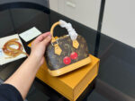 Louis Vuitton Alma Shell Bag Timeless Versatility Cherry Pattern - Image 2