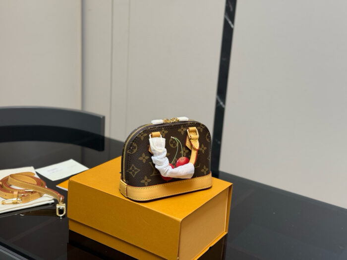 Louis Vuitton Alma Shell Bag Timeless Versatility Cherry Pattern - Image 7