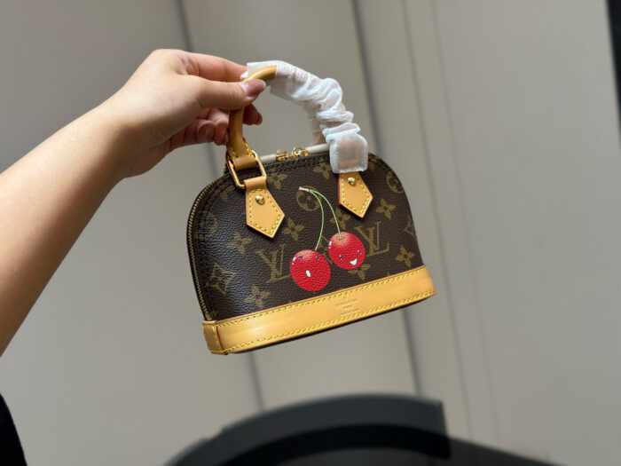 Louis Vuitton Alma Shell Bag Timeless Versatility Cherry Pattern - Image 9