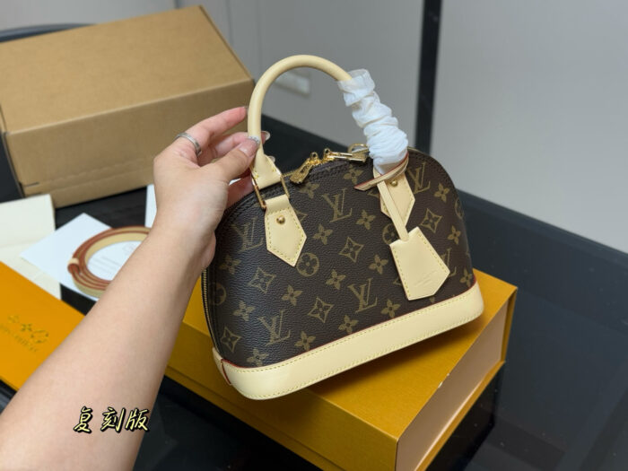 Louis Vuitton Alma Shell Bag Classic Versatility Original Hardware - Image 2