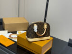 Louis Vuitton Alma Shell Bag Classic Versatility Original Hardware - Image 8