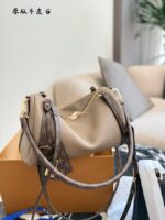 Louis Vuitton Express Handbag Structured Silhouette Versatile Carrying Options Generous Capacity Luxurious Leather - Image 3