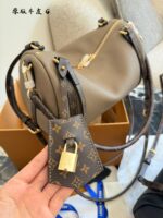 Louis Vuitton Express Handbag Structured Silhouette Versatile Carrying Options Generous Capacity Luxurious Leather - Image 6