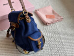 Miu Miu Blue And Brown Leather Drawstring Backpack Multi-Pocket Design For Practicality - Image 4