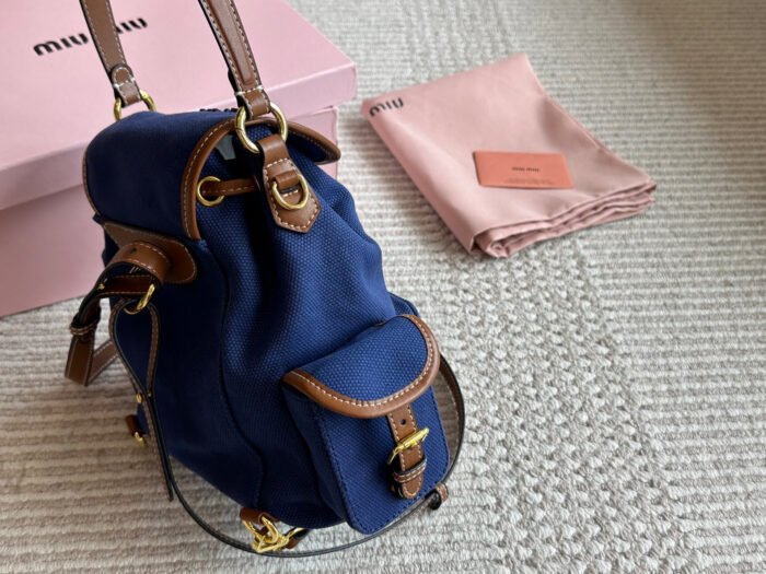 Miu Miu Blue And Brown Leather Drawstring Backpack Multi-Pocket Design For Practicality - Image 4