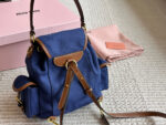 Miu Miu Blue And Brown Leather Drawstring Backpack Multi-Pocket Design For Practicality - Image 5