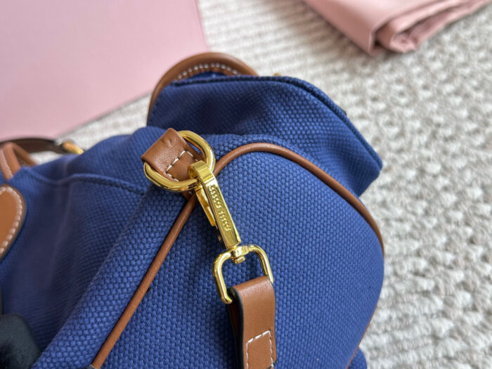 Miu Miu Blue And Brown Leather Drawstring Backpack Multi-Pocket Design For Practicality - Image 6