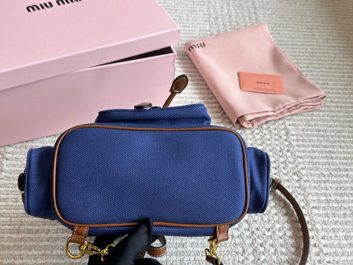 Miu Miu Blue And Brown Leather Drawstring Backpack Multi-Pocket Design For Practicality - Image 7