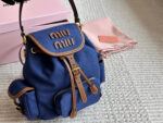 Miu Miu Blue And Brown Leather Drawstring Backpack Multi-Pocket Design For Practicality - Image 8