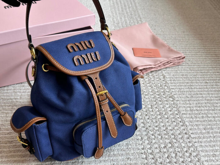 Miu Miu Blue And Brown Leather Drawstring Backpack Multi-Pocket Design For Practicality - Image 8
