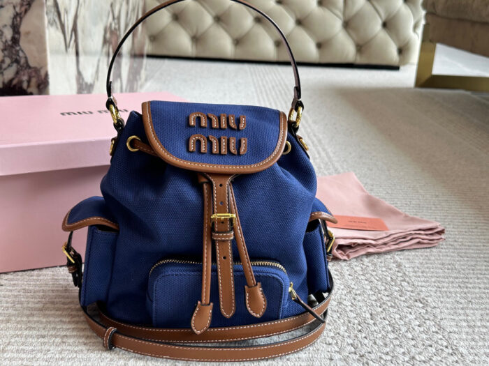 Miu Miu Blue And Brown Leather Drawstring Backpack Multi-Pocket Design For Practicality - Image 10