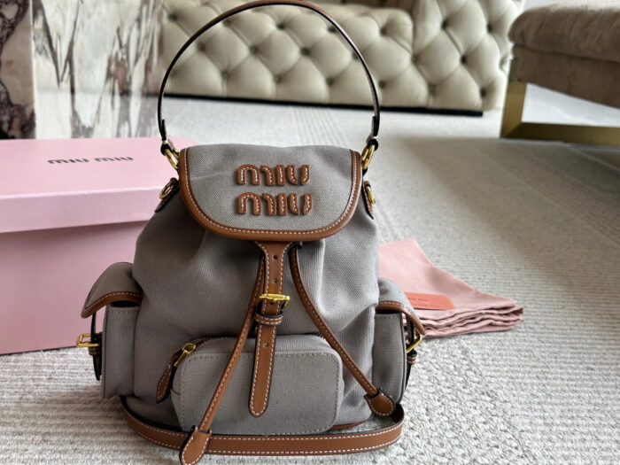 Miu Miu Blue And Brown Leather Drawstring Backpack Multi-Pocket Design For Practicality - Image 11
