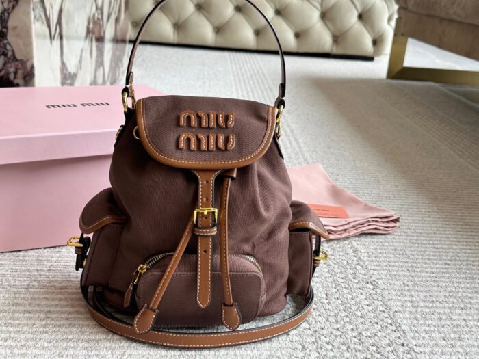Miu Miu Blue And Brown Leather Drawstring Backpack Multi-Pocket Design For Practicality - Image 12