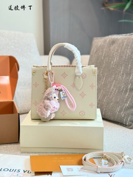Louis Vuitton Onthego Collection May New Release: Cream Strawberry Tote Bag Classic Silhouette With Integrated Charm Carry By Hand, Shoulder Or Crossbody