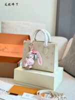Louis Vuitton Onthego Collection May New Release: Cream Strawberry Tote Bag Classic Silhouette With Integrated Charm Carry By Hand, Shoulder Or Crossbody - Image 2