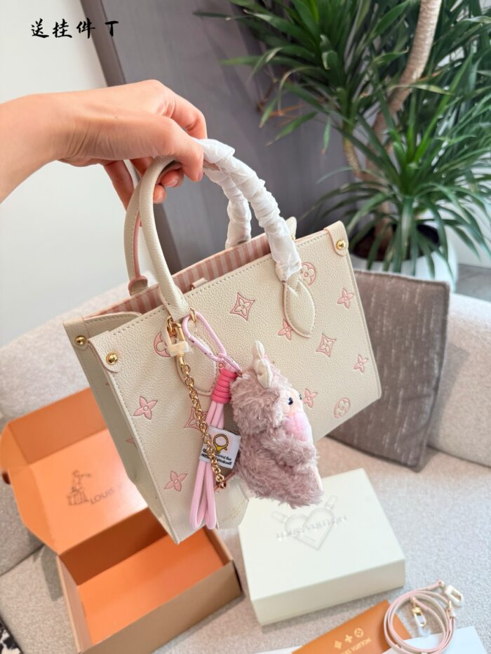 Louis Vuitton Onthego Collection May New Release: Cream Strawberry Tote Bag Classic Silhouette With Integrated Charm Carry By Hand, Shoulder Or Crossbody - Image 8