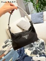 Prada Nylon Dumpling Bag Charming Silhouette Leather-Reinforced Corners Spacious And Versatile - Image 2