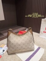 Tory Burch Hobo Horn Bag Multi-Pocket Design With Generous Capacity Commute, Date, Travel Bag - Image 12