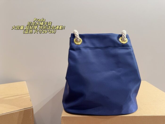 Prada Nylon Bucket Bag Spacious And Ultra-Lightweight For Commuting Metal Rings On Both Sides For Attaching Charms - Image 3