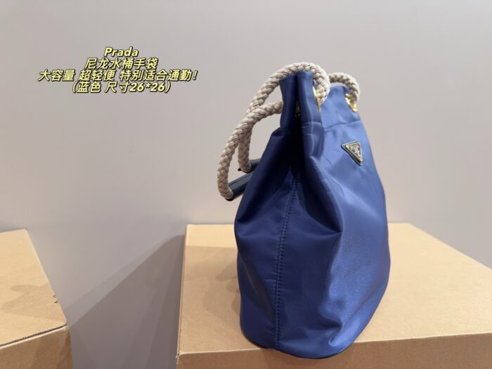 Prada Nylon Bucket Bag Spacious And Ultra-Lightweight For Commuting Metal Rings On Both Sides For Attaching Charms - Image 4
