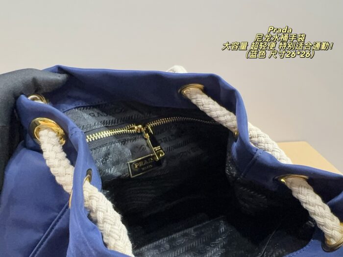 Prada Nylon Bucket Bag Spacious And Ultra-Lightweight For Commuting Metal Rings On Both Sides For Attaching Charms - Image 7