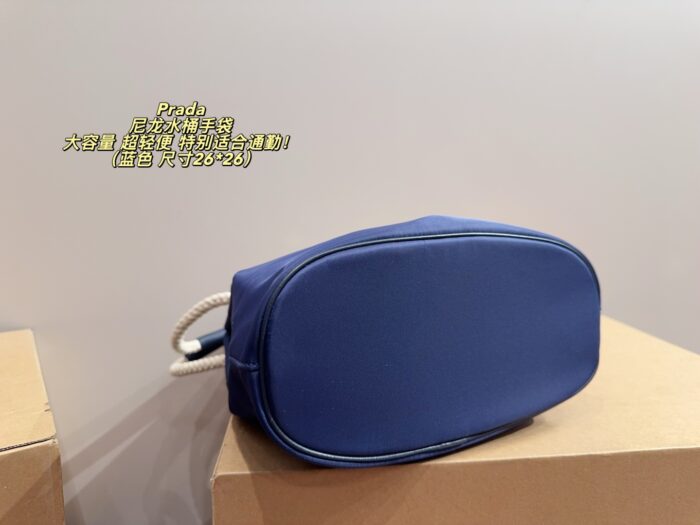 Prada Nylon Bucket Bag Spacious And Ultra-Lightweight For Commuting Metal Rings On Both Sides For Attaching Charms - Image 8