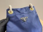 Prada Nylon Bucket Bag Spacious And Ultra-Lightweight For Commuting Metal Rings On Both Sides For Attaching Charms - Image 9