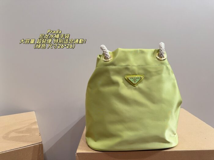 Prada Nylon Bucket Bag Spacious And Ultra-Lightweight For Commuting Metal Rings On Both Sides For Attaching Charms - Image 11