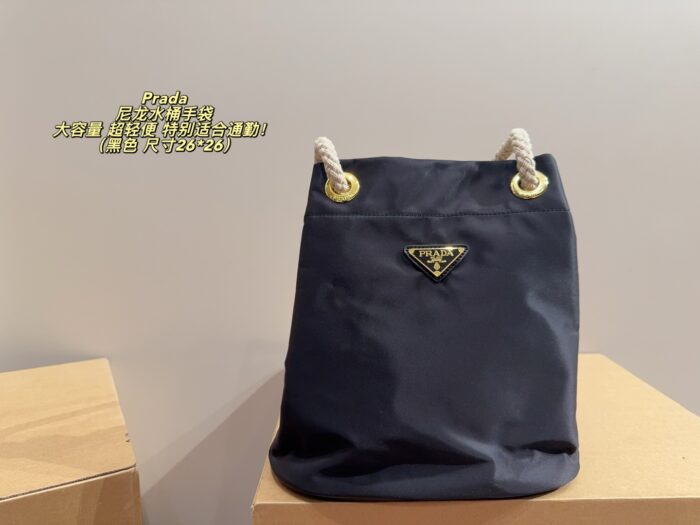 Prada Nylon Bucket Bag Spacious And Ultra-Lightweight For Commuting Metal Rings On Both Sides For Attaching Charms - Image 12