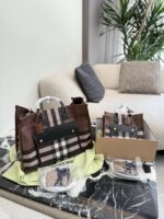 Burberry'S Latest Tote Bag In Classic Check Pattern Calfskin Leather. Features An Adjustable Shoulder Strap, Snap Closure, And Ample Capacity. Suitable For Crossbody Or Handheld Carry.
