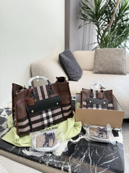 Burberry'S Latest Tote Bag In Classic Check Pattern Calfskin Leather. Features An Adjustable Shoulder Strap, Snap Closure, And Ample Capacity. Suitable For Crossbody Or Handheld Carry.