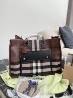 Burberry'S Latest Tote Bag In Classic Check Pattern Calfskin Leather. Features An Adjustable Shoulder Strap, Snap Closure, And Ample Capacity. Suitable For Crossbody Or Handheld Carry. - Image 2