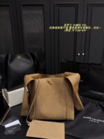 Yves Saint Laurent Cassandre Logo Bucket Bag Soft And Effortless Versatile Black And Gold Adjustable Shoulder Strap