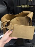 Yves Saint Laurent Cassandre Logo Bucket Bag Soft And Effortless Versatile Black And Gold Adjustable Shoulder Strap - Image 8