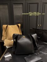 Yves Saint Laurent Cassandre Logo Bucket Bag Soft And Effortless Versatile Black And Gold Adjustable Shoulder Strap - Image 11
