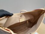 Louis Vuitton 24 Limited Edition Denim Carryall Lightweight And Versatile Styling Riveted Vegetable-Tanned Leather Shoulder Strap - Image 9