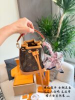Louis Vuitton Nano Noe New Edition Monogram Mini Bucket Bag Detachable Handles And Shoulder Strap For Versatile Carrying Options Practical And Built To Last - Image 3