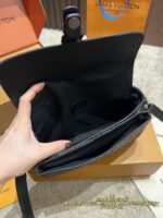 Louis Vuitton Montsouri Embossed Crossbody Messenger Bag Chip Edition All-Black Design Wide Shoulder Strap For Versatility Dual Compartments For Practicality - Image 6